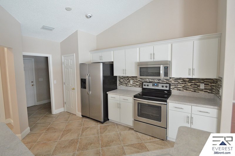 FULLY FENCED 4/2/2 POOL HOME IN THE HEART OF PALM COAST property image