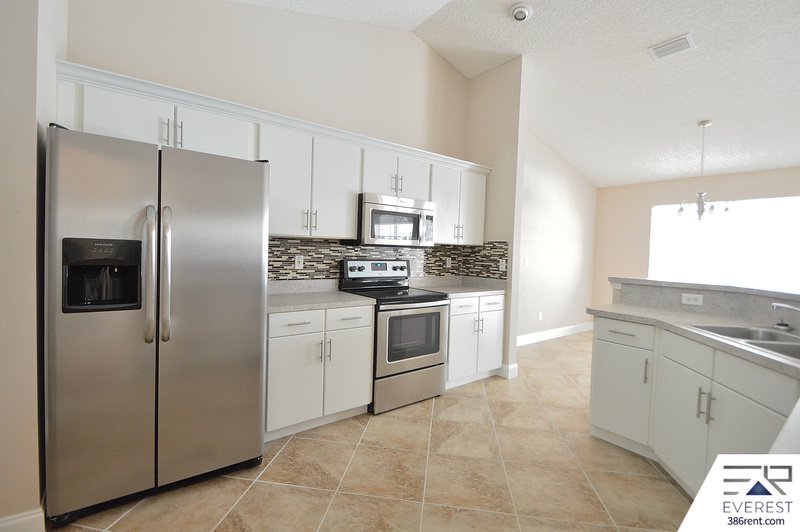 FULLY FENCED 4/2/2 POOL HOME IN THE HEART OF PALM COAST property image