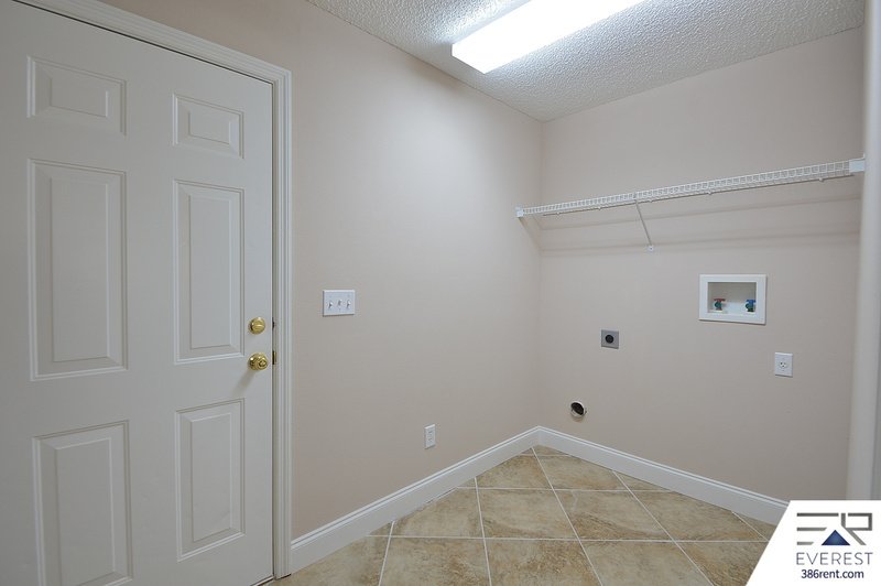 FULLY FENCED 4/2/2 POOL HOME IN THE HEART OF PALM COAST property image