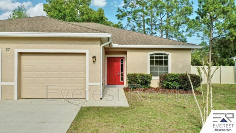 FULLY FENCED 3/2/2 TOWN HOME IN THE HEART OF PALM COAST property image