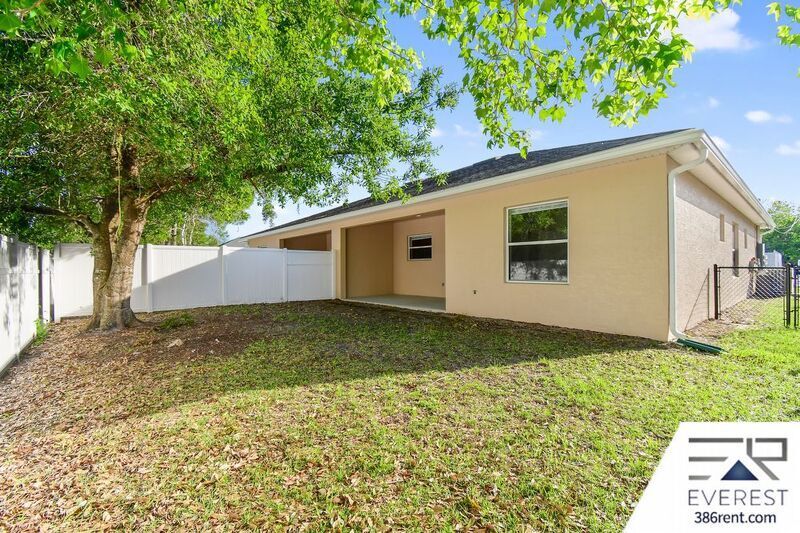 FULLY FENCED 3/2/2 TOWN HOME IN THE HEART OF PALM COAST property image