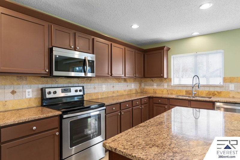 FULLY FENCED, SPACIOUS 4/2.5/2 IN THE HEART OF PALM COAST property image