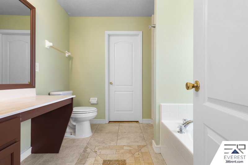 FULLY FENCED, SPACIOUS 4/2.5/2 IN THE HEART OF PALM COAST property image