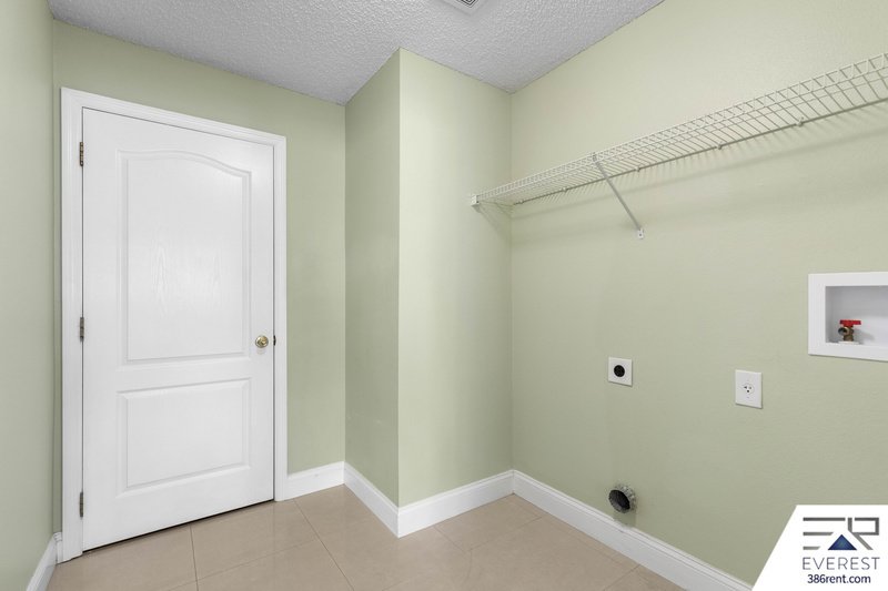 FULLY FENCED, SPACIOUS 4/2.5/2 IN THE HEART OF PALM COAST property image