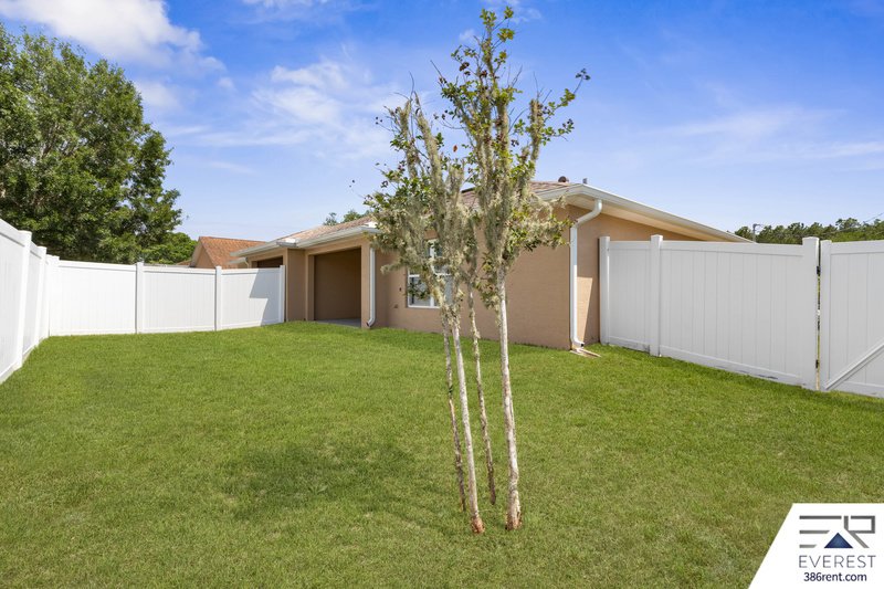 FULLY FENCED, LIKE NEW 3/2/1 IN DESIRABLE MATANZAS WOODS property image